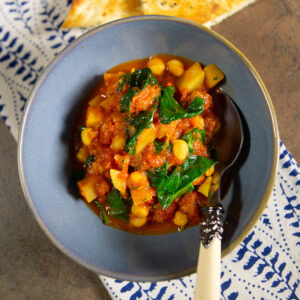 chickpea, tomato and potato curry in a bowl