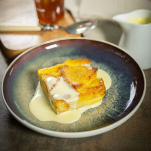 bread and butter pudding slice on a plate